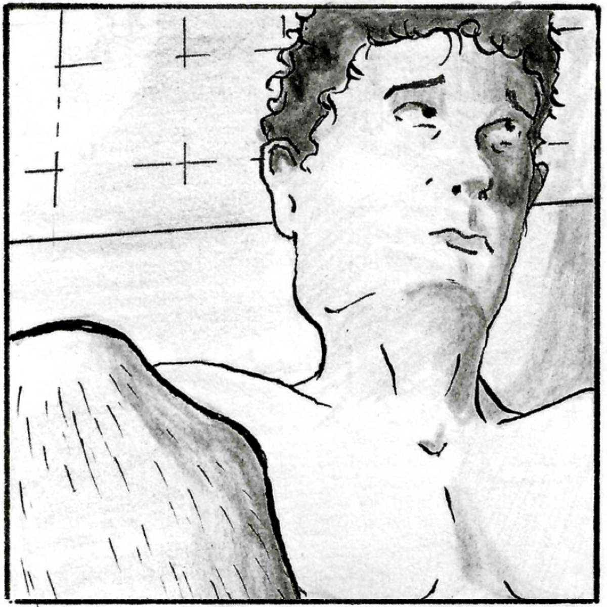 A low angle close up of Adam, in the bath, looking upwards.