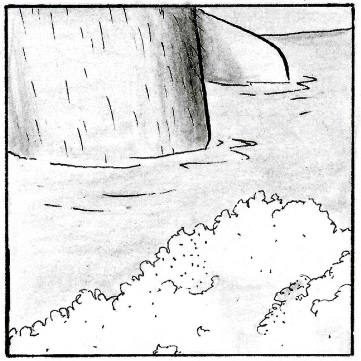 A close up of Adam's leg as he sits in the bath, the knee is above the surface of the water.