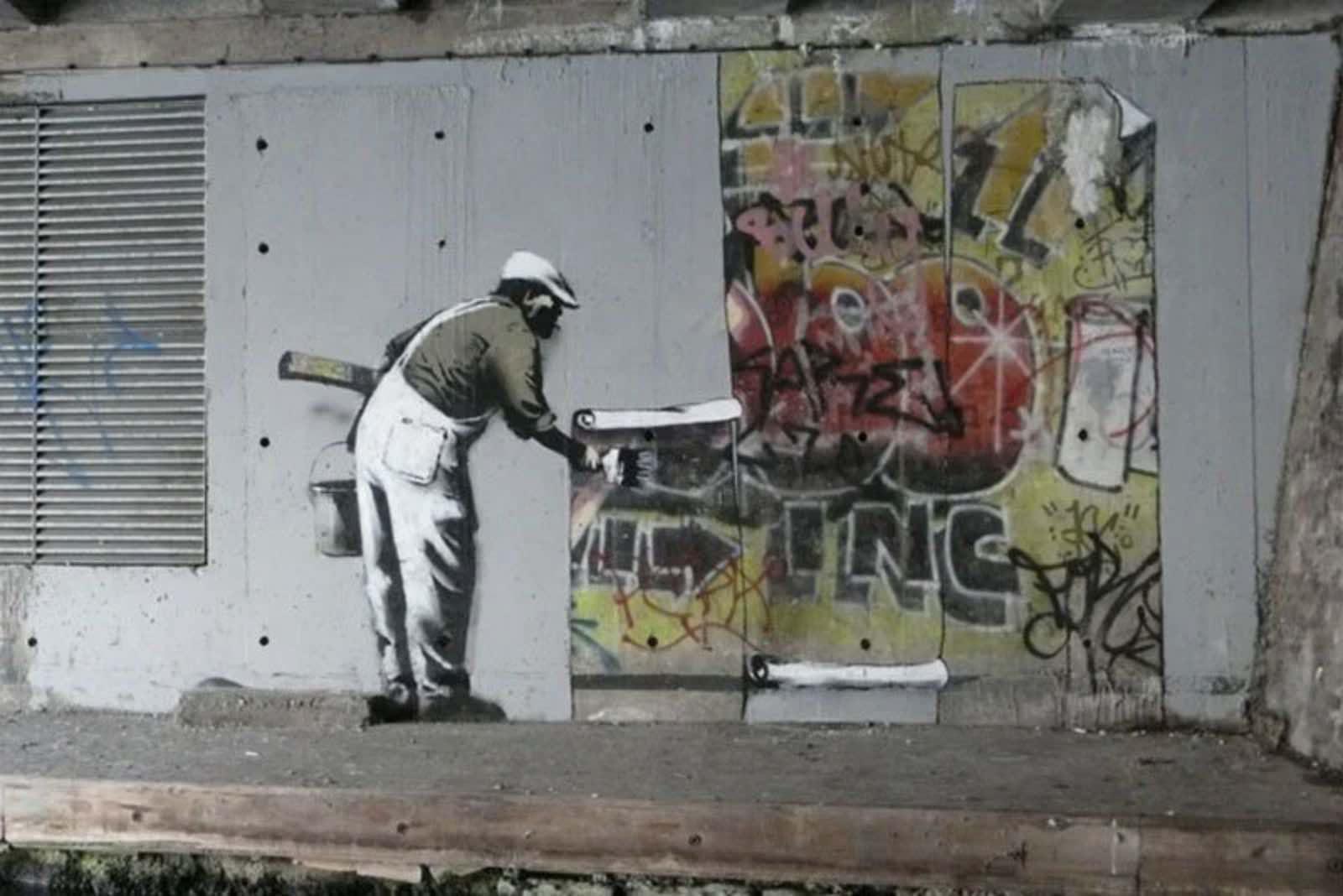 Street art by Banksy on the Regent&rsquo;s Canal, London