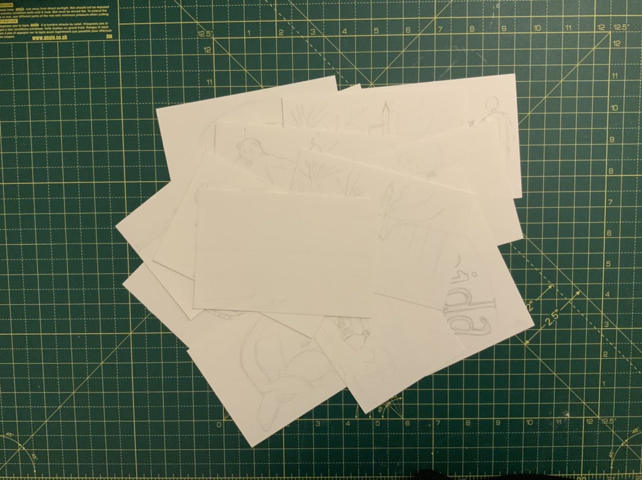 Postcard sketches on a table