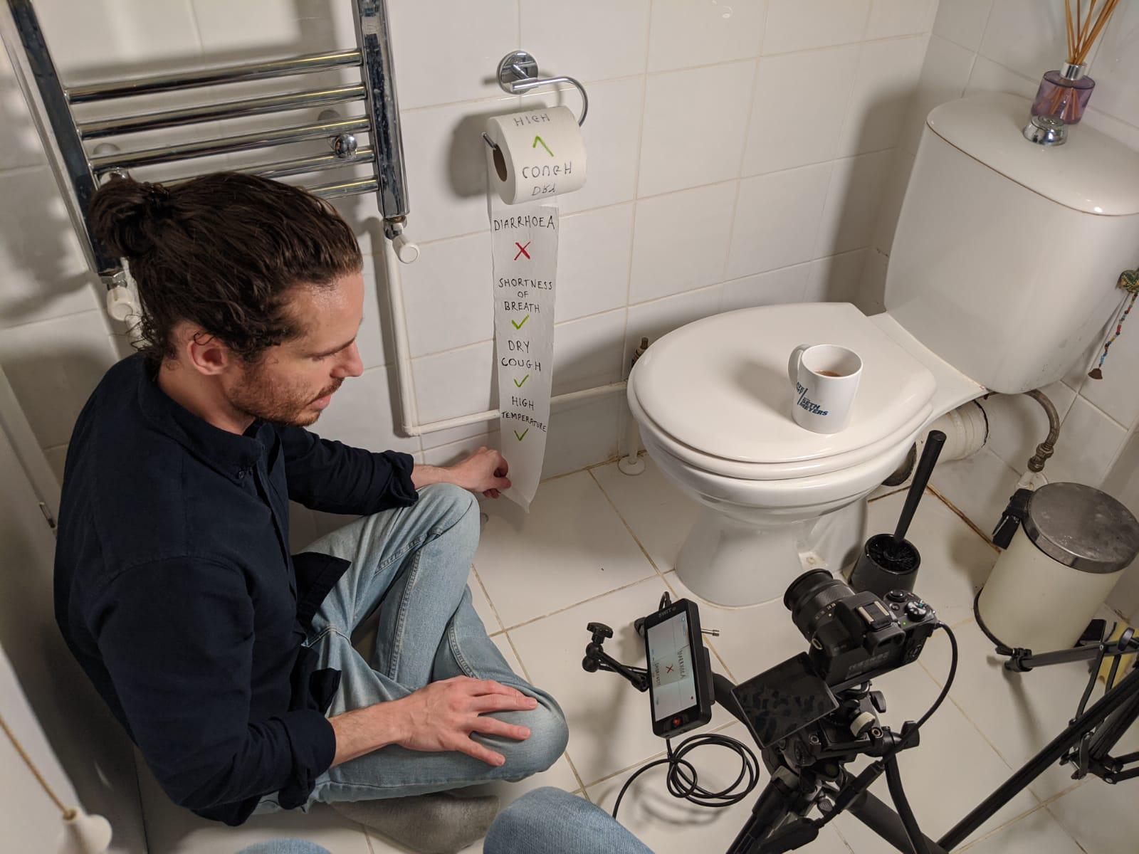 Adam Westbrook and Brendan Miller shooting footage in a bathroom for The New York Times