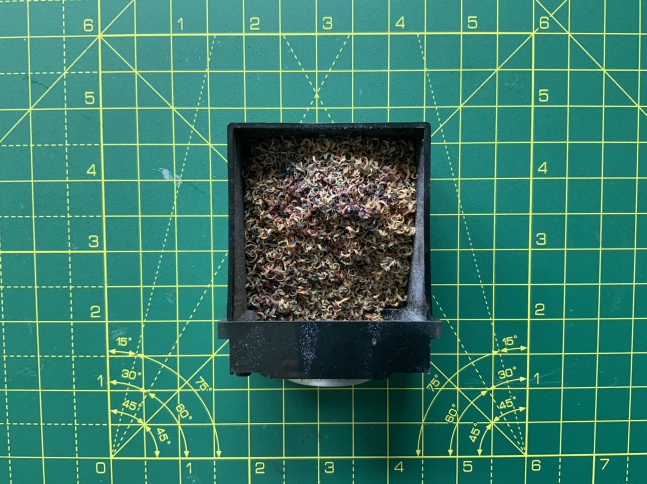 A photo of pencil shavings in a pencil sharpener
