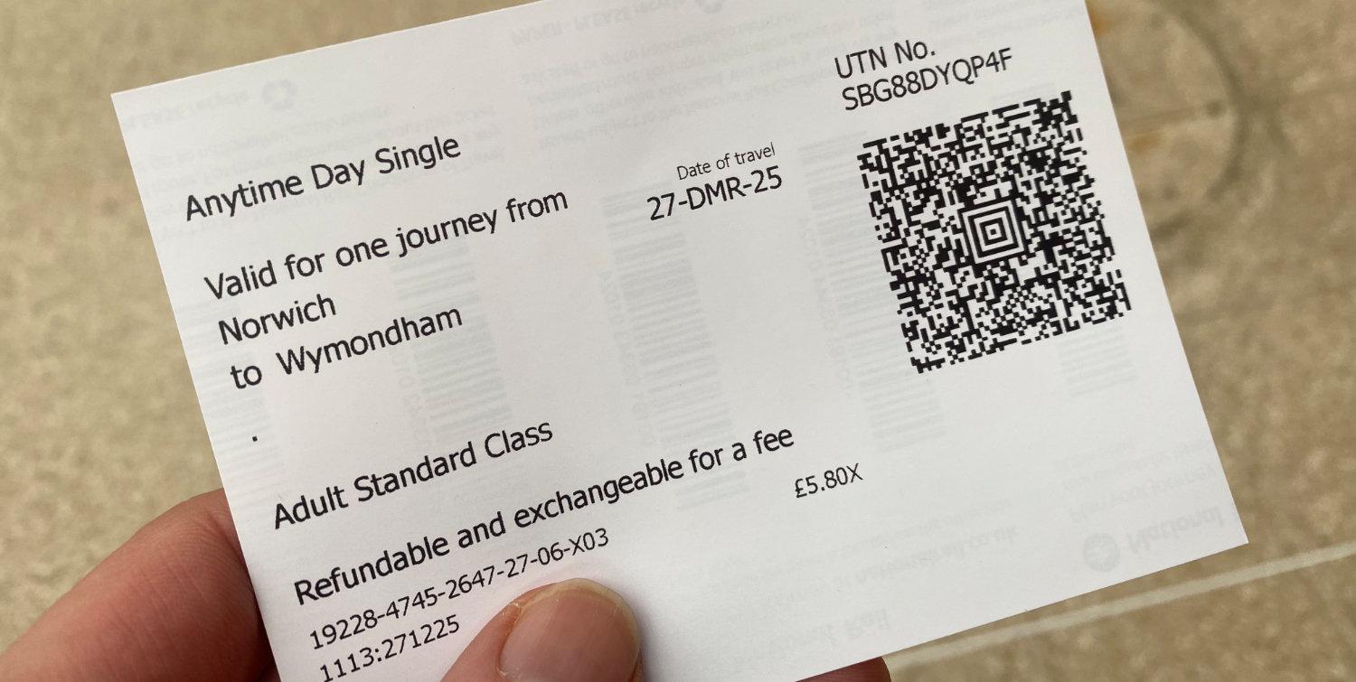 A photograph of me holding a train ticket I had just bought